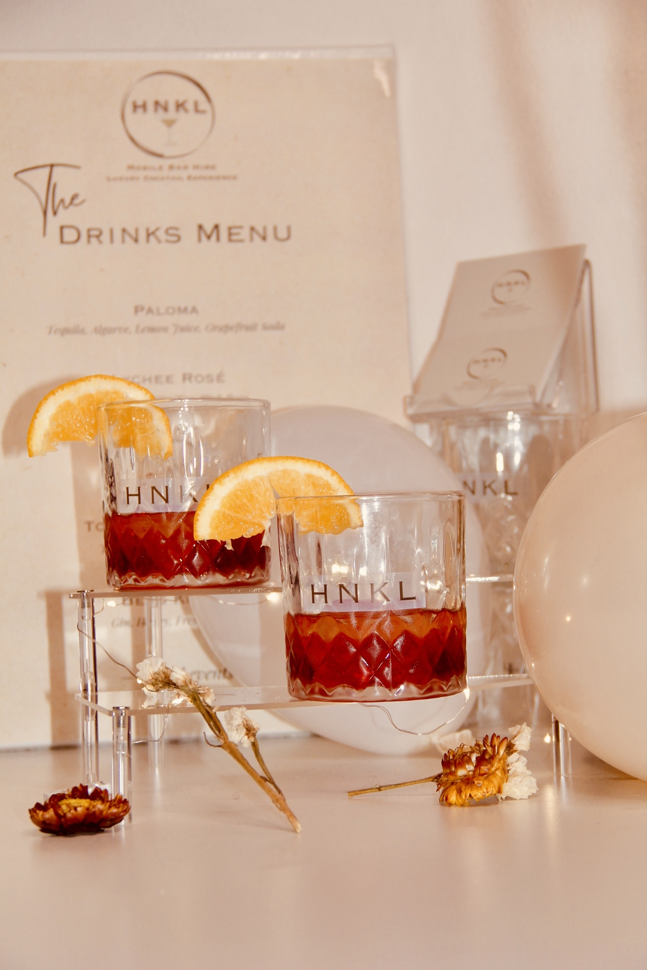 Bartender preparing HNKL cocktail